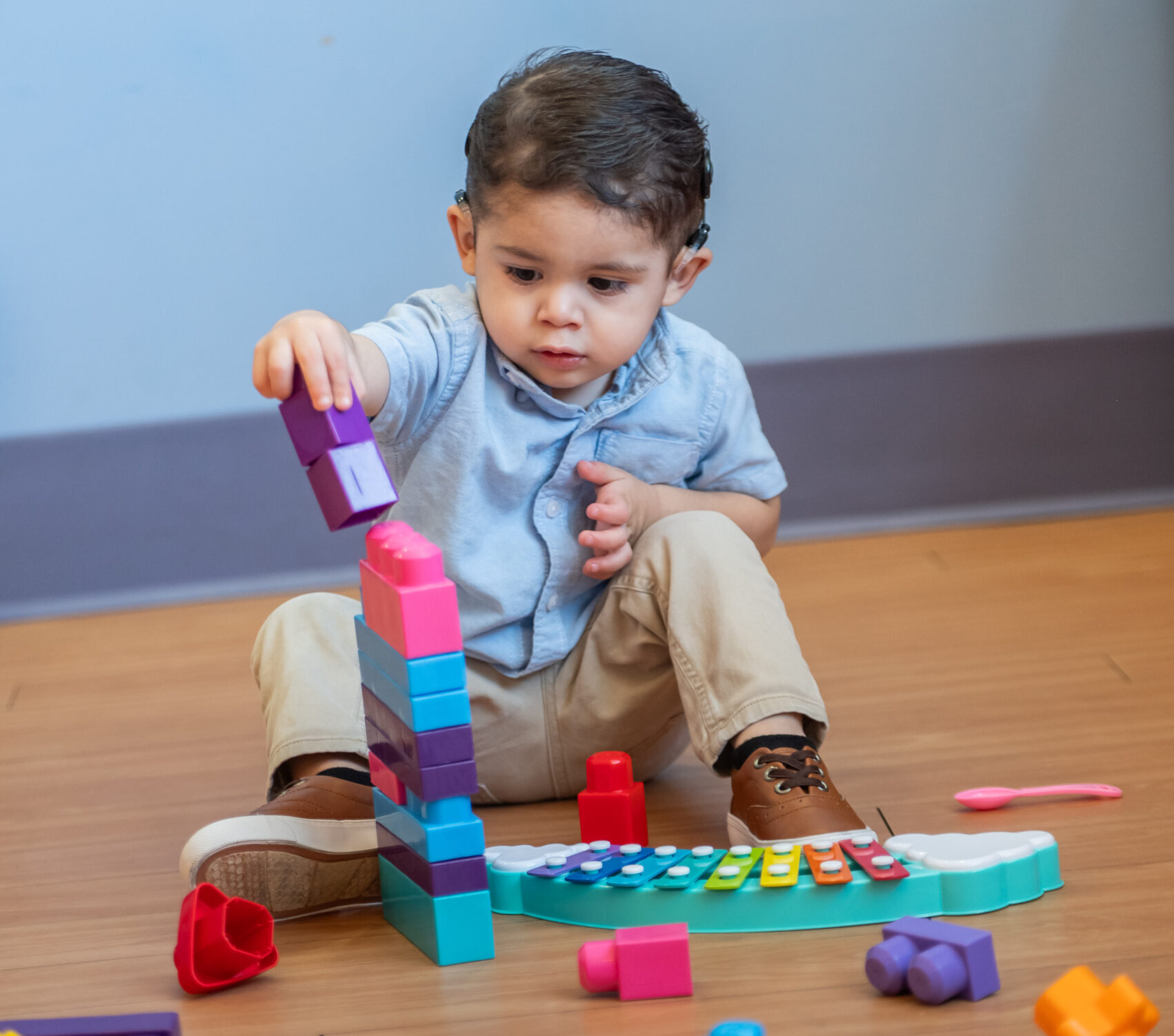 A young child playing with blocks